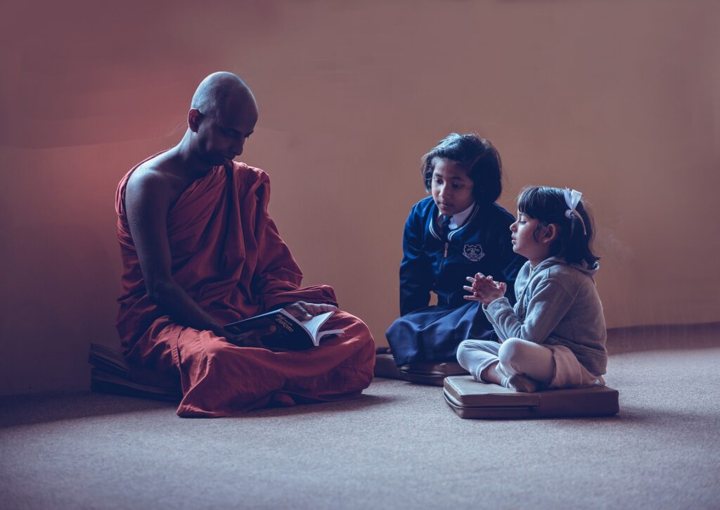 children with a monk - spiritual awakening signs