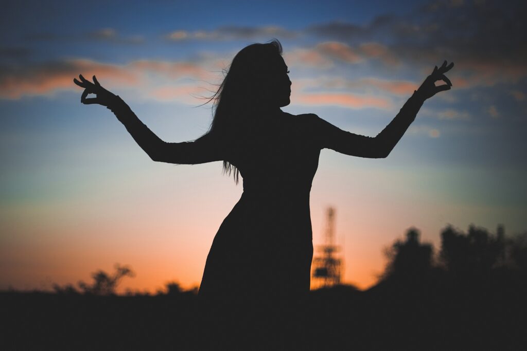 woman in a field - Spiritual Meanings Of Grace