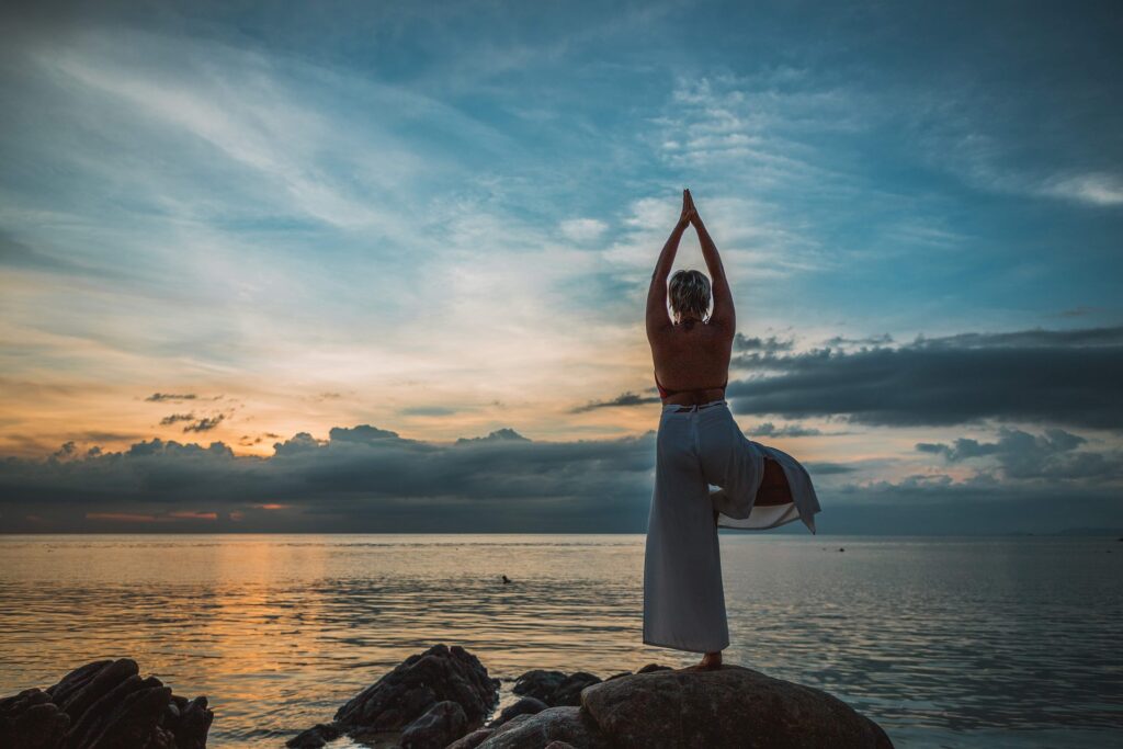 woman doing yoga - Spiritual Meaning of Black and White Birds